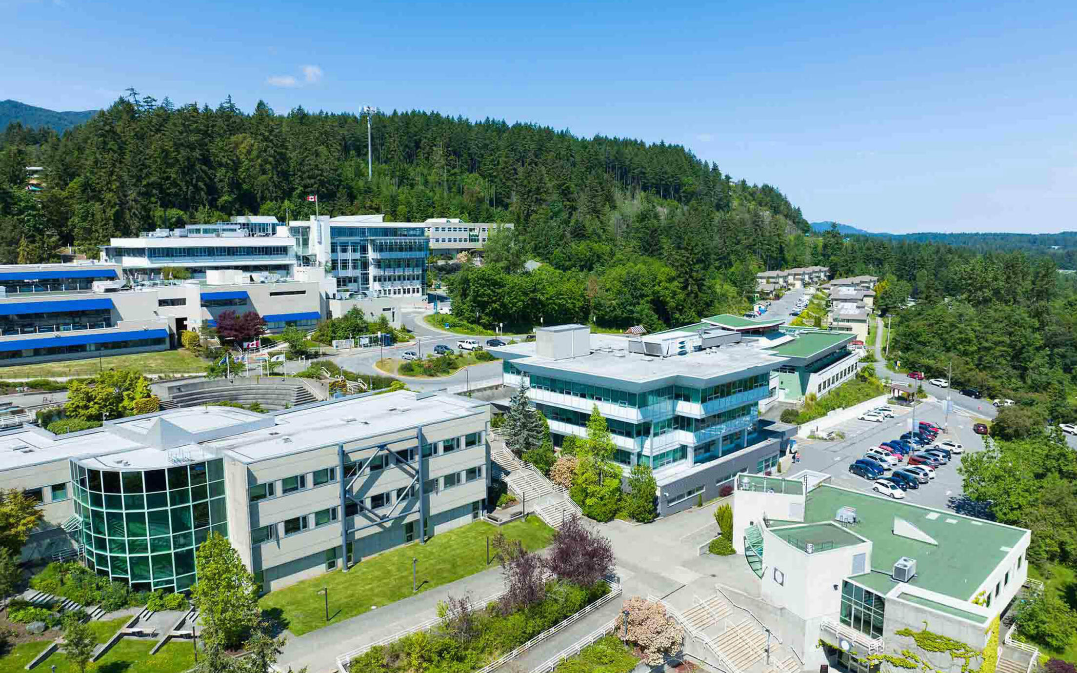 Buildings on a mountainside under a blue sky